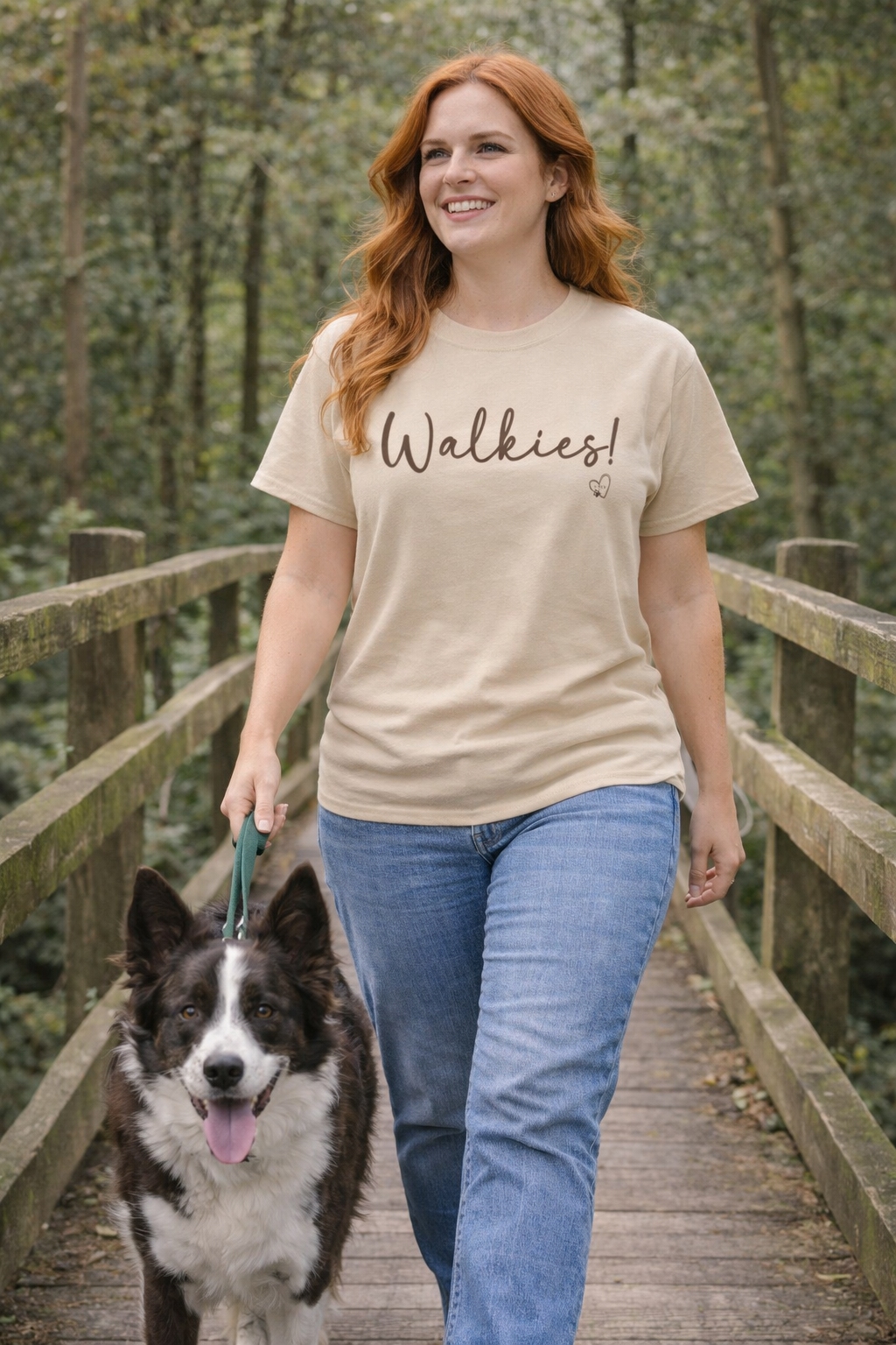 Woman walking a dog on a wooden bridge with 'Walkies!' t-shirt